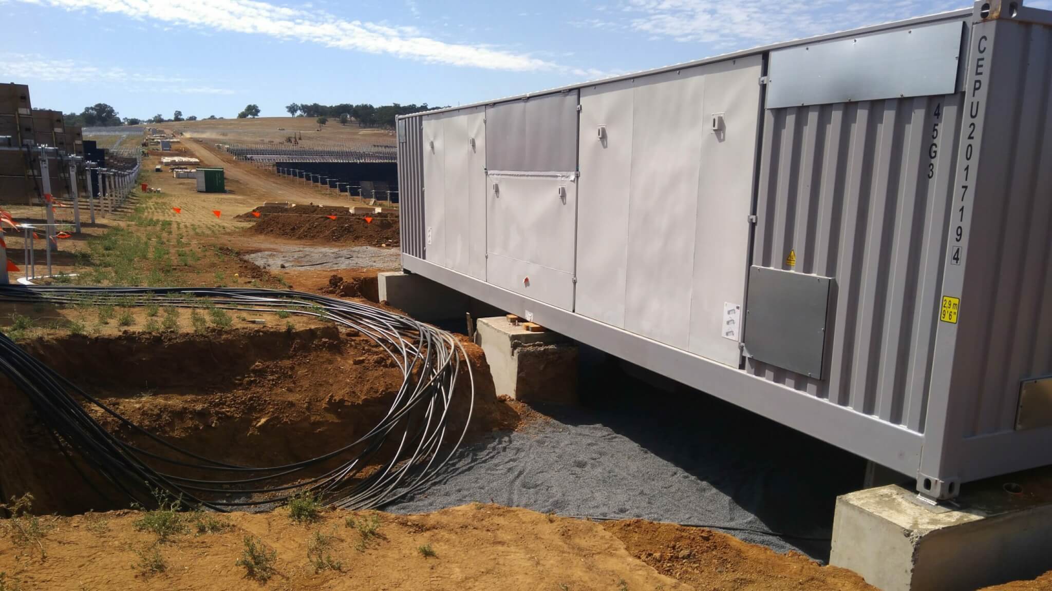 Utility Scale Solar Inverter being installed on a solar farm.